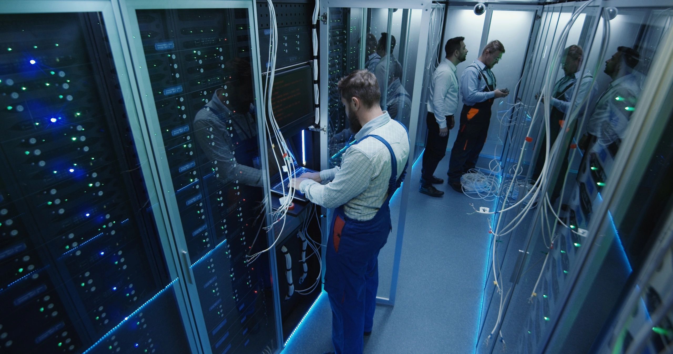 IT professionals reviewing equipment in a server room