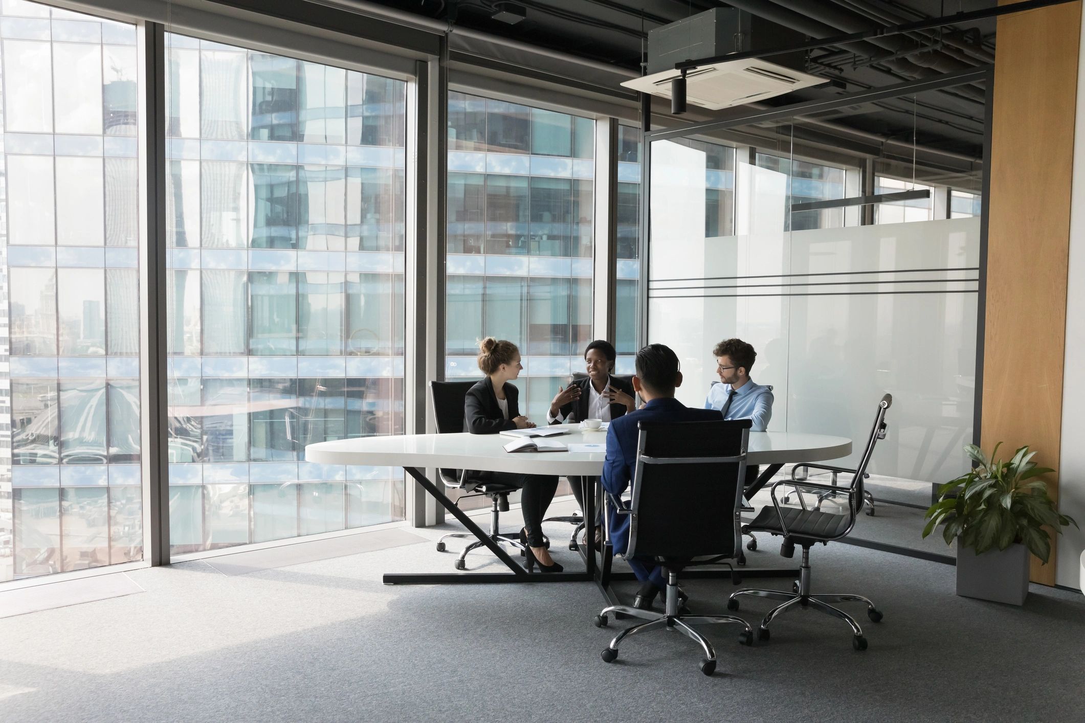 Diverse business team in a meeting room discussing a project